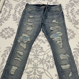 Blue ripped sorta baggy jeans